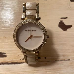 Michael Kors watch with Pearl facing on band as well. No returns